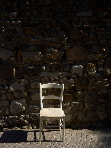 istock old white chair on the street 952426984