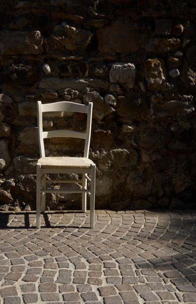 istock old white chair on the street 952426994