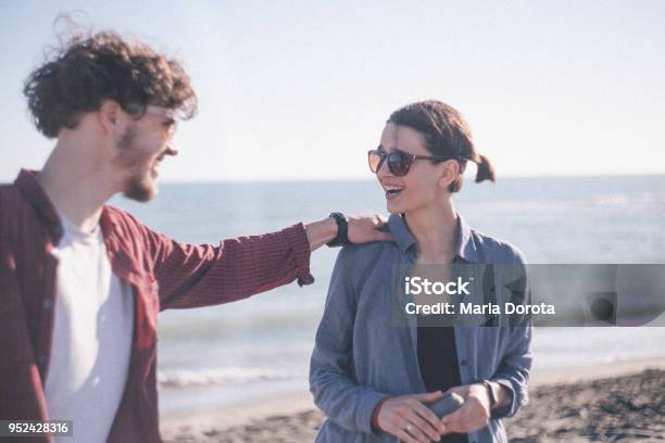 Couple Having Fun At Sunny Beach Stock Photo - Download Image Now - Hand On Shoulder, 20-29 Years, Adult