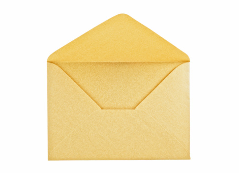 Close-up of closed yellow paper envelope on white background.