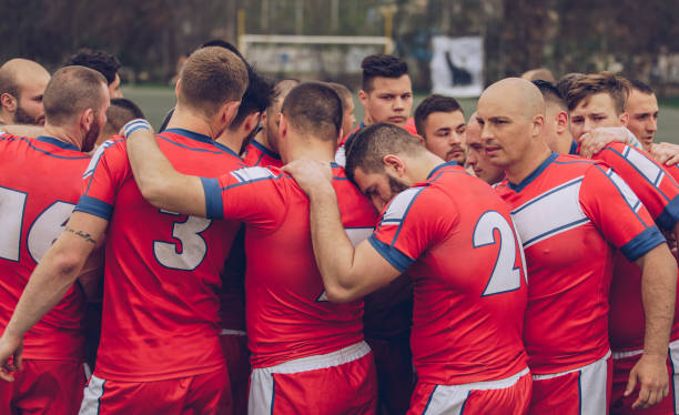 Rugby players huddling during time out Rugby players huddling during time out. rugby team stock pictures, royalty-free photos & images