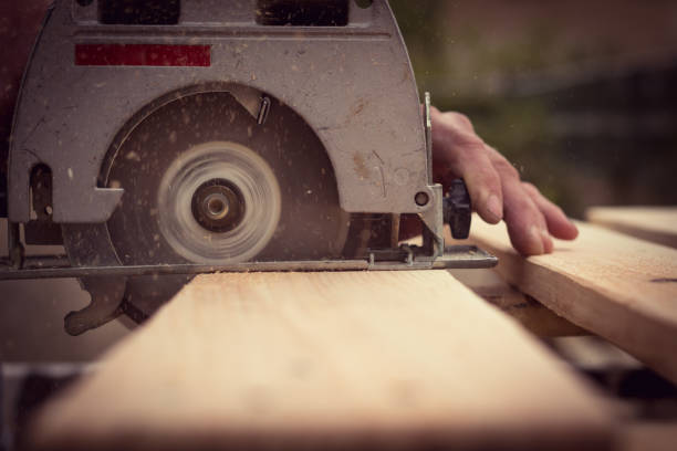 istock Handyman cutting wood with circular saw 952467456