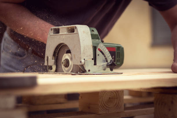 istock Handyman cutting wood with circular saw 952468354