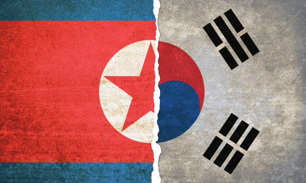 istock South Korea and North Korea torn flags 952470656