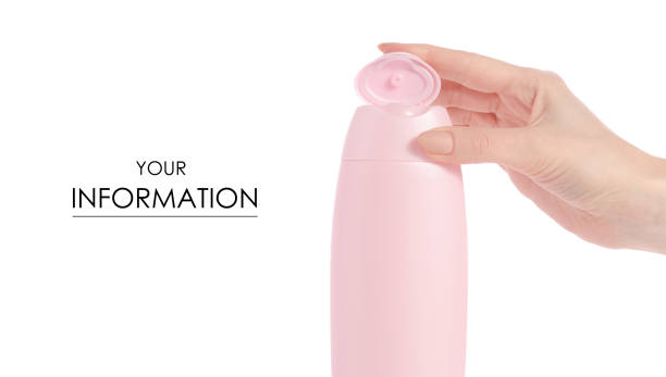istock Shower gel in pink plastic bottle in hand pattern isolated 952471356