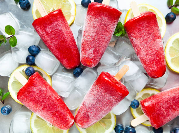 istock frozen strawberry juice snack ice pop or popsicle on a white mar 952476352