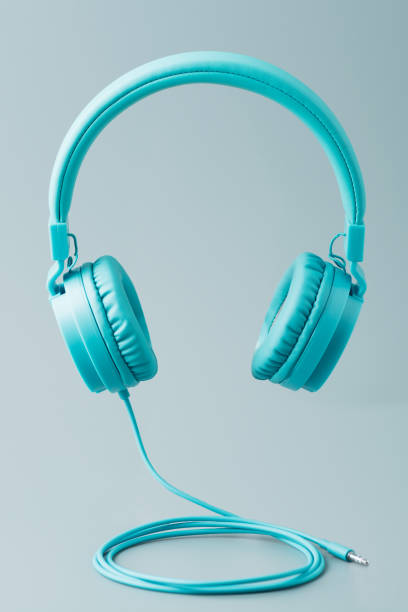 istock Bright blue headphones on gray 952487480