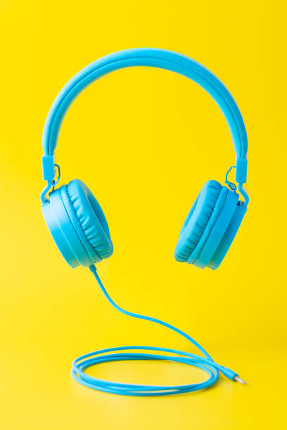 istock Bright blue headphones on yellow 952487486