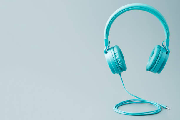istock Bright blue headphones on gray 952487508