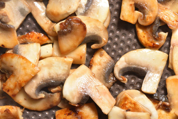 istock Fried mushrooms in a frying pan with non-stick coating. 952488544