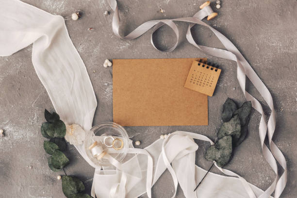 istock Wedding concept. Invitation on a grey background with decorations. Top view, flat lay 952491640