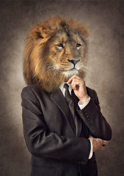Lion in a suit. Man with a head of an lion. Concept graphic. Lion in a suit. Man with a head of an lion. Concept graphic in vintage style with soft oil painting style mask disguise photos stock pictures, royalty-free photos & images