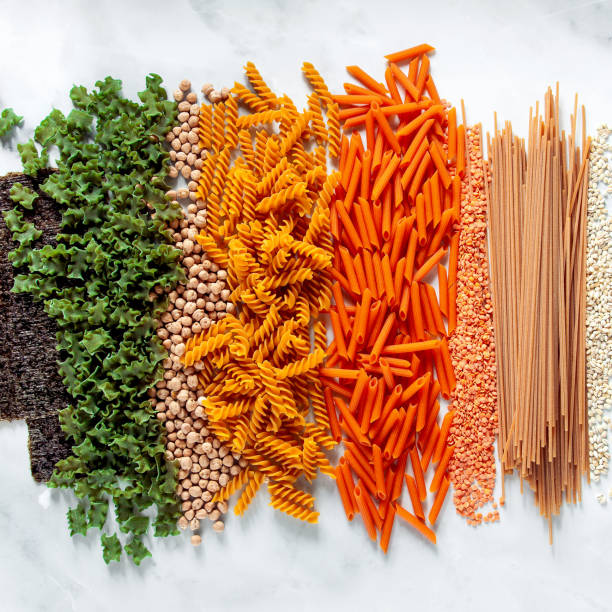 different types of gluten-free paste from chickpeas, red lentils, algae and healthy cereals on a white marble table. labels for writing text. shot from above. food background