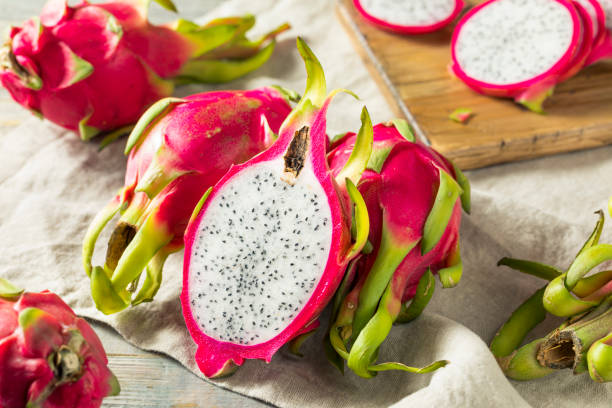 Raw Red Organic Dragon Fruit Raw Red Organic Dragon Fruit in a Bunch pitaya photos stock pictures, royalty-free photos & images