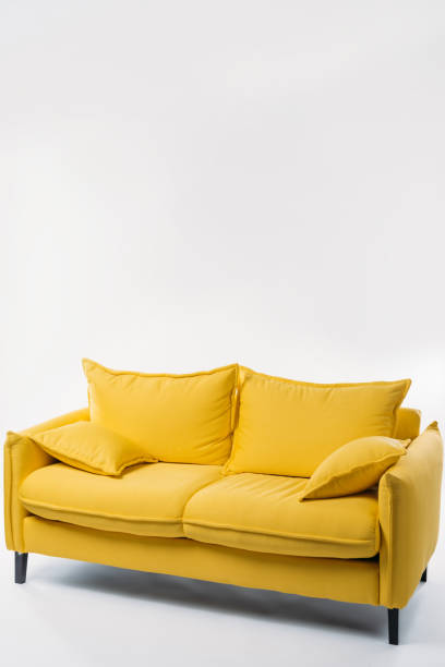 istock studio shot of trendy yellow sofa, on white 952513938