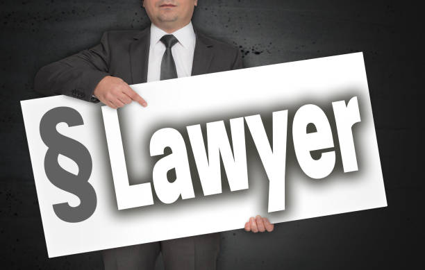 istock Lawyer poster is held by businessman 952514066