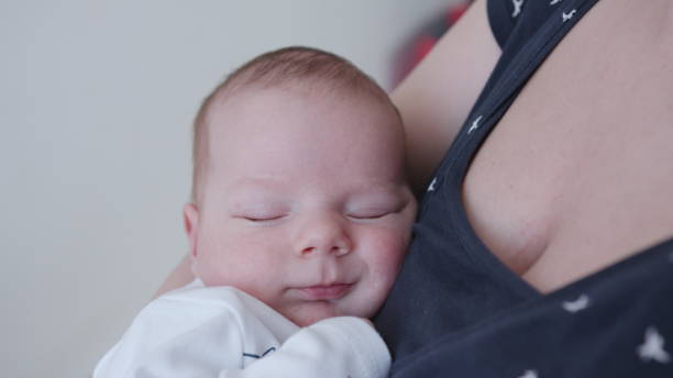 istock Young Mother Holding Her Baby 952527848