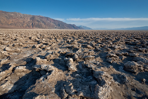 The Devil's Golf Course is a large salt pan on the floor of Badwater Basin located in the Mojave Desert within Death Valley National Park, California, USA. It was named after a line in the 1934 National Park Service guide book to Death Valley which stated that \