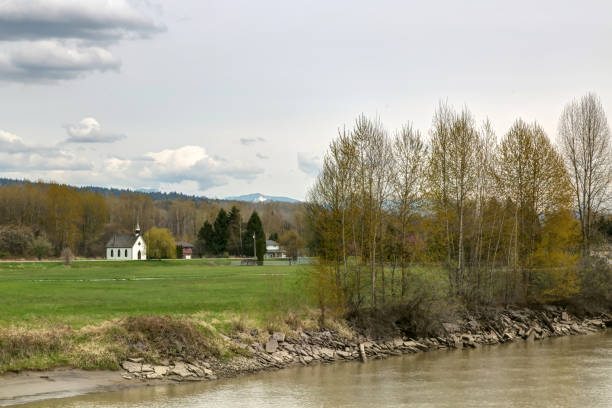 istock farmland by river in spring 952531500