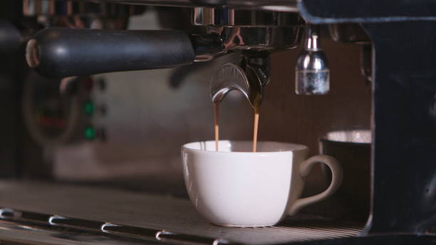 istock Close-up of Espresso Pouring from Coffee Machine 952538814