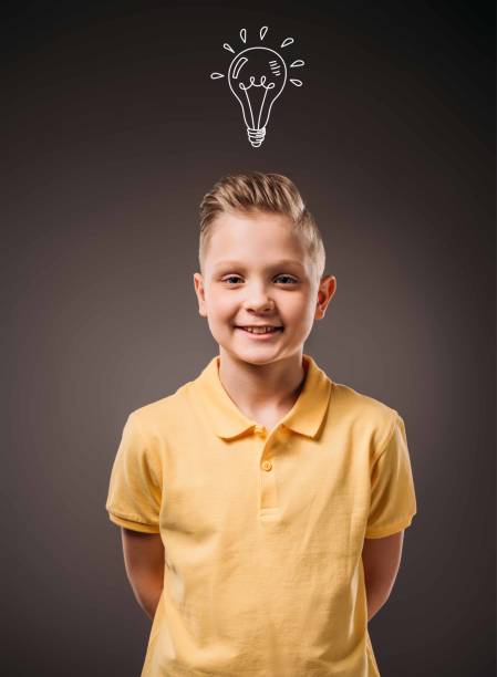 istock adorable preteen smiling boy, isolated on grey 952542246