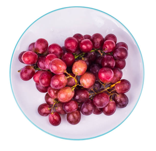 istock Plate with sweet, ripe red grapes 952545856