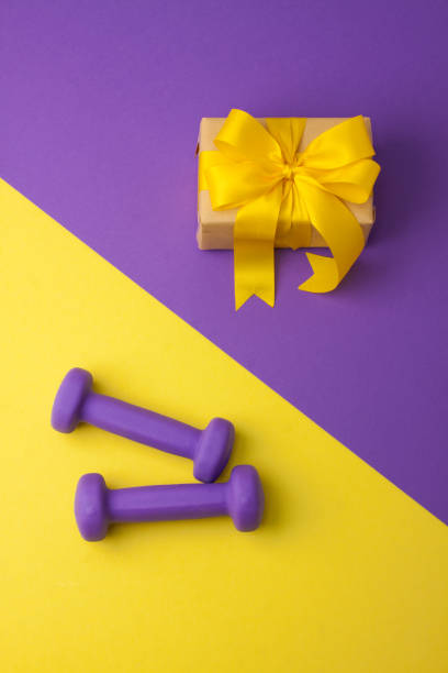 istock Sport flat lay composition with dumbbells and gift box 952552690