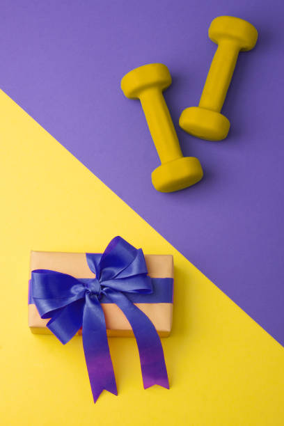 istock Sport flat lay composition with dumbbells and gift box 952552706