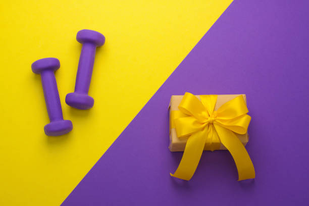 istock Sport flat lay composition with dumbbells and gift box 952552716