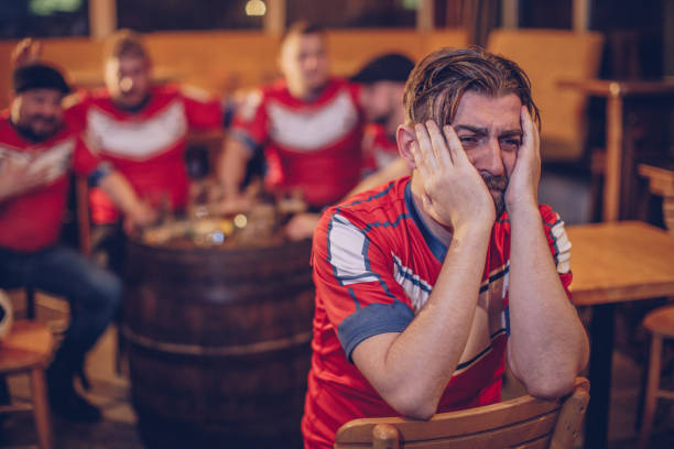 istock Disappointed football fans 952553008
