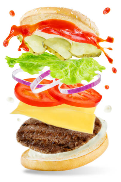 istock Flying meat Burger with mayonnaise and ketchup splat 952556808