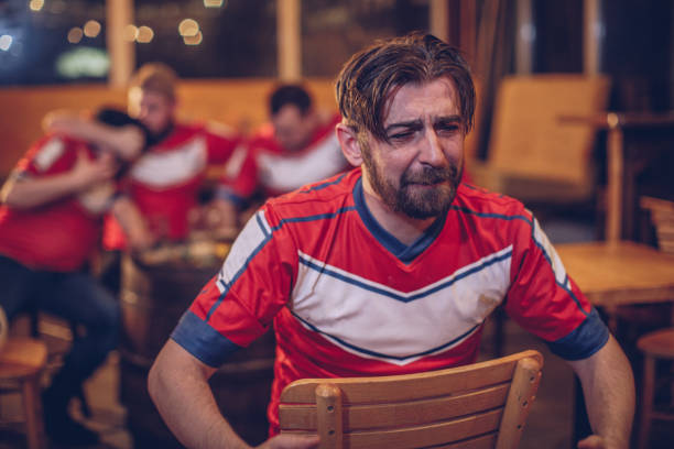 istock Sad football fans 952560398