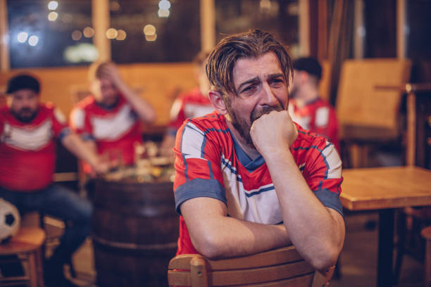 istock Annoyed football fans 952561174