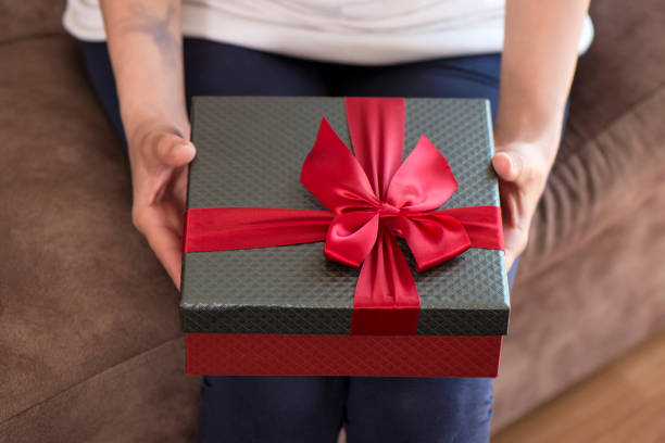 istock Woman Holding Gift Box 952562520