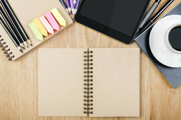 istock Wooden workspace with supplies and coffee 952575402