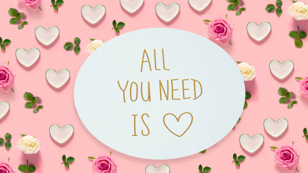 istock All You Need Is Love message with roses and hearts 952586652