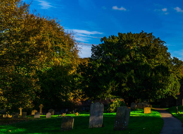 istock Old Medieval english Cemetery, gravestones, typical old British cemetery on a sunny day 952606436