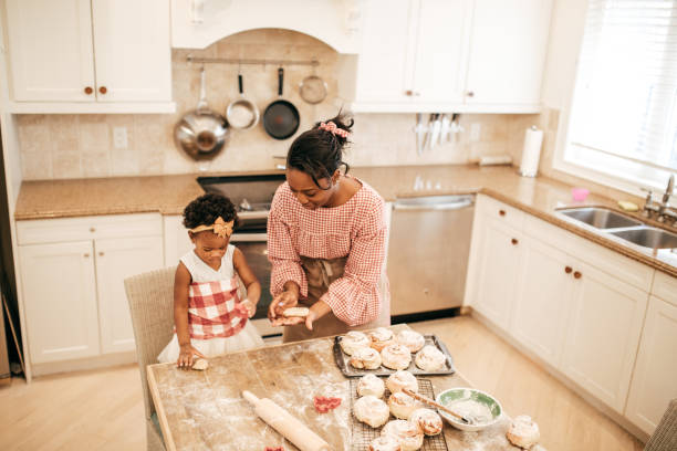 istock Mom and toddler baking together 952624394