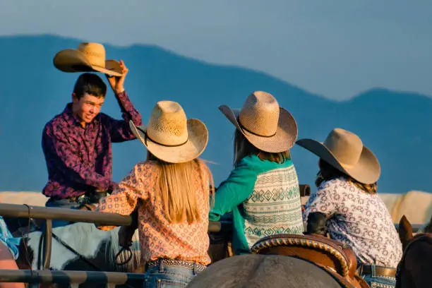 Photo of Teenager Cowboy greeting cowgirls