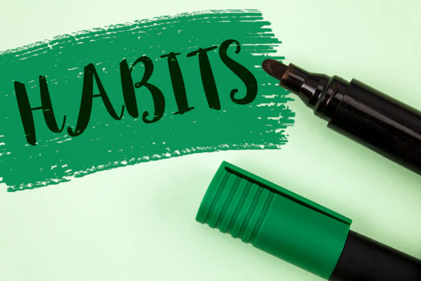 istock Text sign showing Habits. Conceptual photo Regular tendency or practice Routine Usual Manners Behavior Pattern written on Painted Green background Markers next to it. 952643980