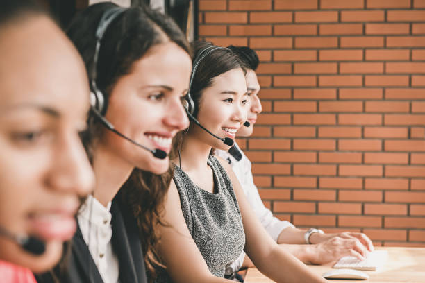 istock Smiling multiethnic telemarketing customer service agent team working in call center office 952644220