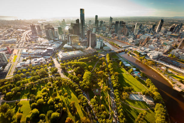 Melbourne Skyline Aerial view of Melbourne Australia at sunset with landmarks melbourne australia stock pictures, royalty-free photos & images