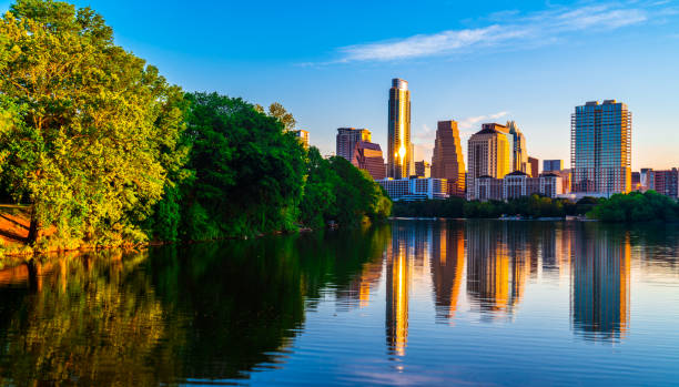 gorgeous summer sunrise along shoreline town lake reflections austin , texas , usa skyline cityscape - town home imagens e fotografias de stock