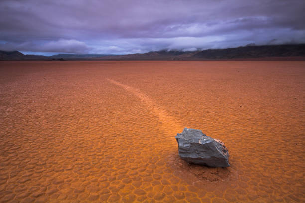 Sailing Stones in Racetrack Playa One of the famous sailing stones of the Racetrack Playa in Death Valley National Park, California. racetrack playa stock pictures, royalty-free photos & images