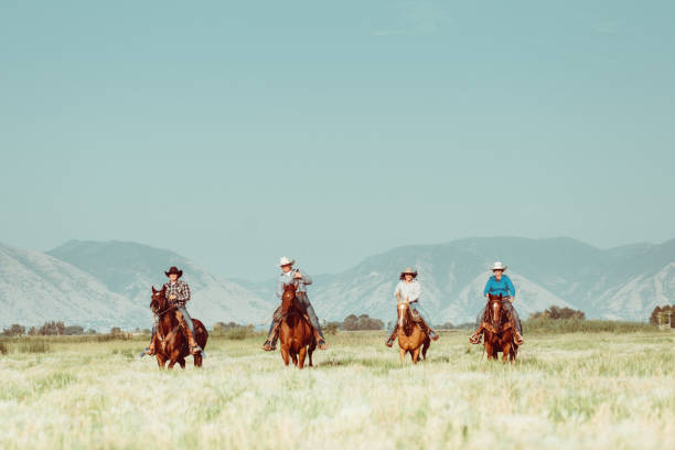 istock Group of friends horseback riding 952675210