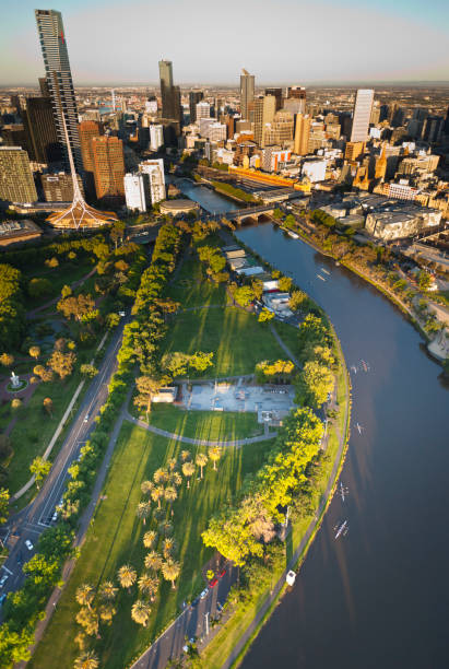 Melbourne Skyline Aerial view of Melbourne Australia at sunset with landmarks yarra river stock pictures, royalty-free photos & images