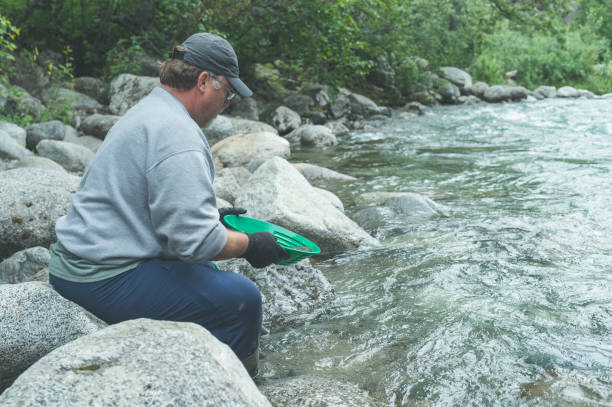 istock A man searches for gold in Alaska 952679444