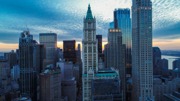 The scenic aerial view of Manhattan Downtown includes the major skyscrapers: The Woolworth Building, Transportation Building, Barclay Tower, and more The scenic aerial view of Manhattan Downtown includes the major skyscrapers: The Woolworth Building, Transportation Building, Barclay Tower, and more. nassau street stock pictures, royalty-free photos & images