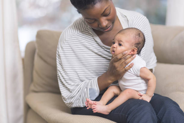 istock Mama holding her newborn baby 952682248
