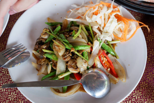 oyster shell Stir Fried Black Pepper and vegetables selective focus on the table